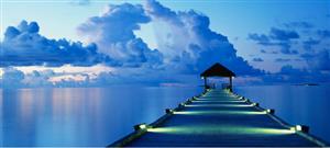 Dock with blue sky and water 